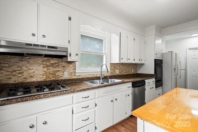 1512 Anthony Dr, Gastonia, NC 28052 - kitchen with under cabinet range hood, white refrigerator with ice dispenser, black oven, gas cooktop, and stainless steel dishwasher