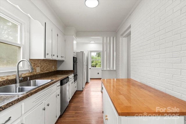1512 Anthony Dr, Gastonia, NC 28052 - kitchen featuring dishwasher, butcher block countertops, white cabinets, dark wood-style floors, and oven