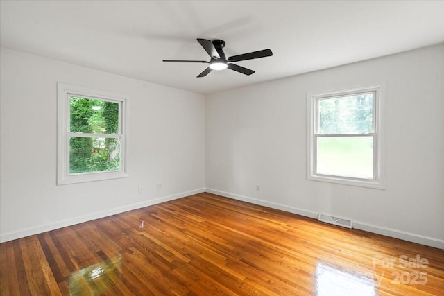 1512 Anthony Dr, Gastonia, NC 28052 - empty room with wood finished floors and a ceiling fan