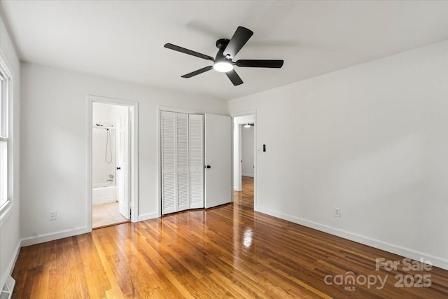 1512 Anthony Dr, Gastonia, NC 28052 - unfurnished bedroom featuring wood finished floors, a closet, connected bathroom, and ceiling fan