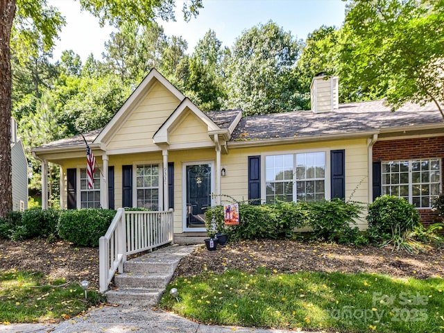 9337 Four Mile Creek Rd Unit 101, Charlotte, NC 28277 - single story home with a chimney, covered porch, and brick siding