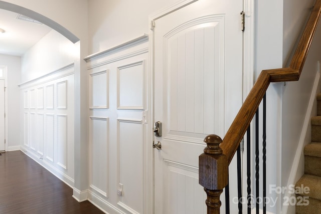 2405 Emma Grace Ln, Rock Hill, SC 29732 - entrance foyer featuring arched walkways, dark wood-type flooring, and stairway