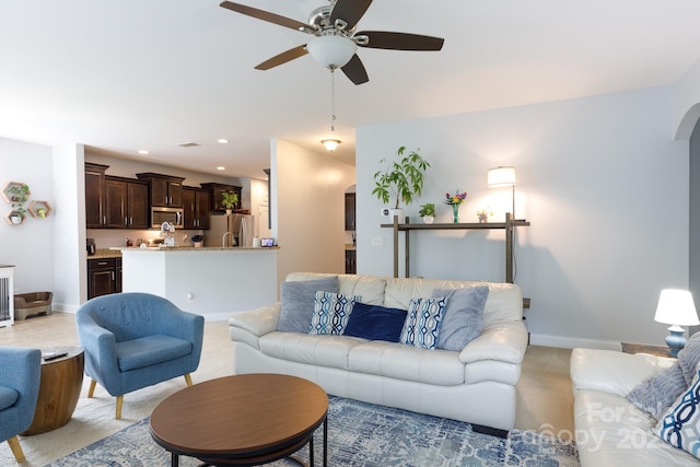 2405 Emma Grace Ln, Rock Hill, SC 29732 - living room featuring a ceiling fan, arched walkways, light colored carpet, and recessed lighting