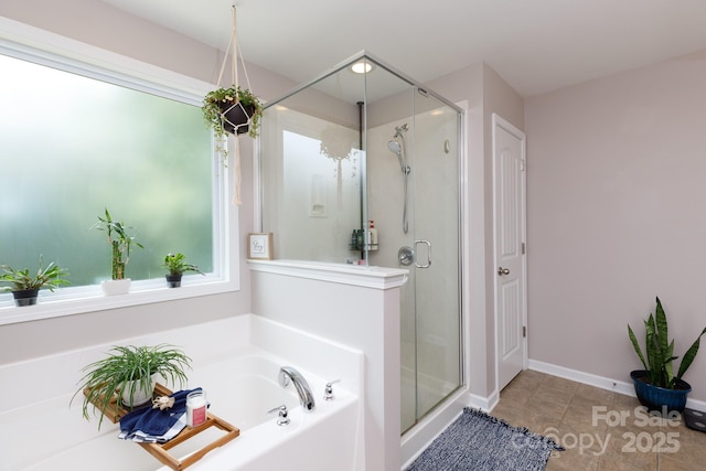 2405 Emma Grace Ln, Rock Hill, SC 29732 - bathroom with a bath, a stall shower, and tile patterned flooring