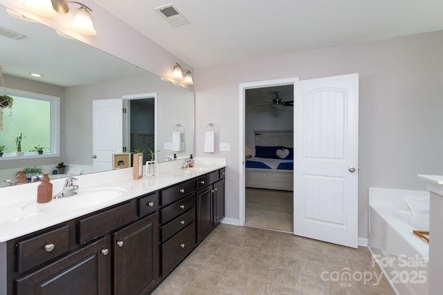 2405 Emma Grace Ln, Rock Hill, SC 29732 - ensuite bathroom with double vanity, a garden tub, and ceiling fan