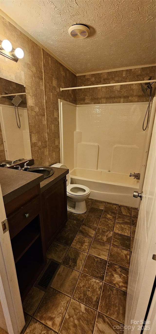 6220 Dekalb Dr, Connelly Springs, NC 28612 - full bathroom featuring a textured ceiling,  shower combination, vanity, and toilet