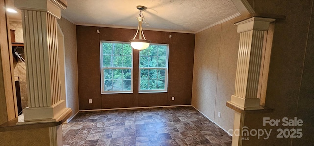 6220 Dekalb Dr, Connelly Springs, NC 28612 - unfurnished dining area featuring decorative columns, stone finish flooring, ornamental molding, and a textured ceiling