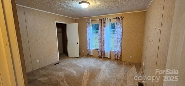 6220 Dekalb Dr, Connelly Springs, NC 28612 - carpeted empty room with ornamental molding and a textured ceiling