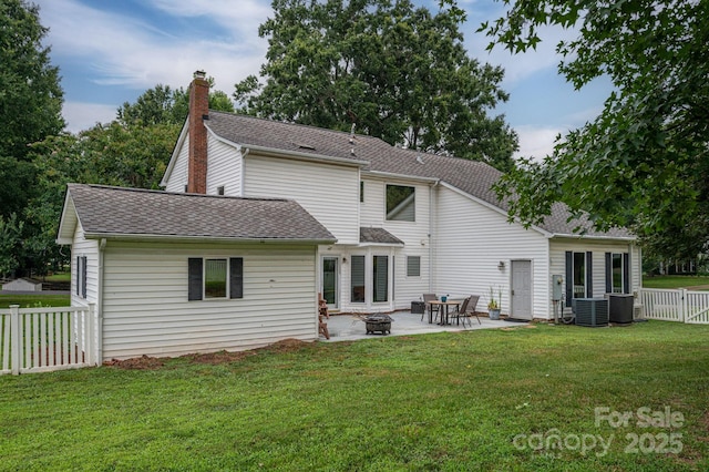 13403 Kensal Green Dr, Charlotte, NC 28278 - back of property featuring a fire pit, a patio, a fenced backyard, roof with shingles, and a chimney