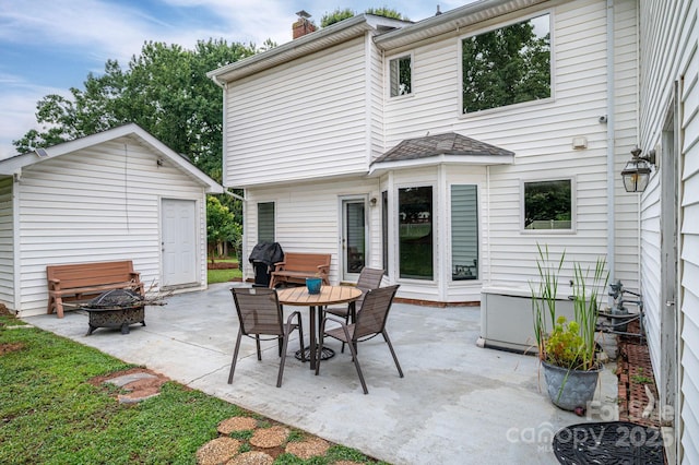 13403 Kensal Green Dr, Charlotte, NC 28278 - view of patio / terrace featuring a fire pit, grilling area, and an outbuilding