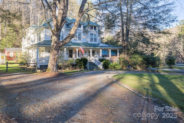 4584 NC Highway 194 S, Banner Elk, NC 28604 - view of front facade featuring covered porch and a front yard