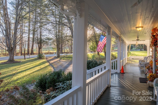 4584 NC Highway 194 S, Banner Elk, NC 28604 - porch with a ceiling fan and a yard