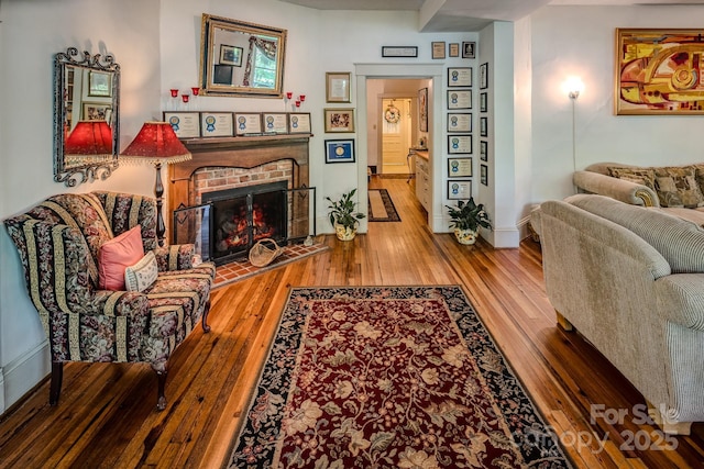 4584 NC Highway 194 S, Banner Elk, NC 28604 - living area featuring hardwood / wood-style floors and a brick fireplace