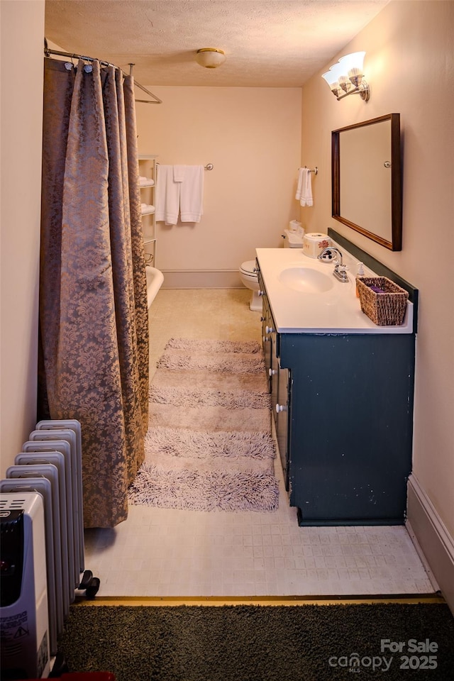 4584 NC Highway 194 S, Banner Elk, NC 28604 - bathroom featuring radiator, vanity, curtained shower, and a textured ceiling