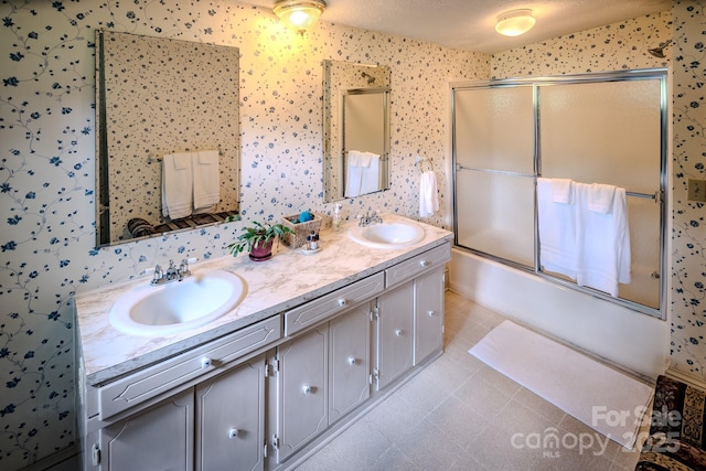 4584 NC Highway 194 S, Banner Elk, NC 28604 - bathroom with double vanity, bath / shower combo with glass door, and wallpapered walls