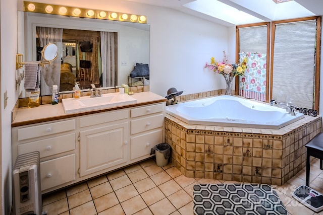 4584 NC Highway 194 S, Banner Elk, NC 28604 - bathroom with a bath, vanity, tile patterned floors, and a skylight