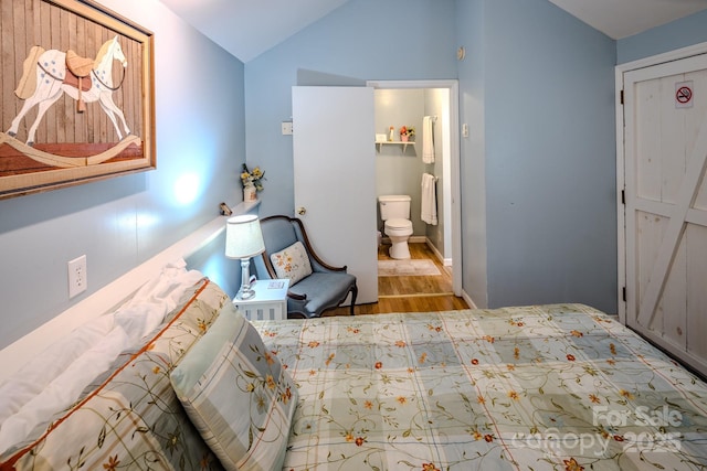 4584 NC Highway 194 S, Banner Elk, NC 28604 - bedroom featuring wood finished floors, lofted ceiling, and ensuite bath