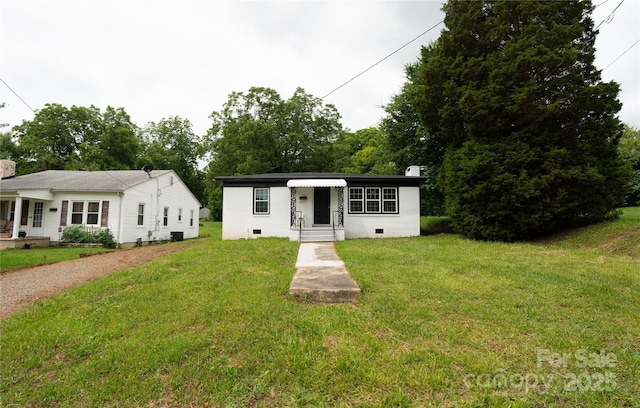 1017 W Fisher St, Salisbury, NC 28144 - view of front facade with a chimney, a front yard, and crawl space