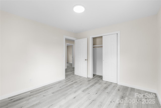 1017 W Fisher St, Salisbury, NC 28144 - unfurnished bedroom featuring light wood-type flooring and a closet