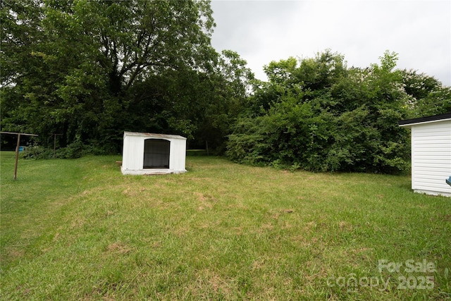 1017 W Fisher St, Salisbury, NC 28144 - view of grassy yard with a storage shed