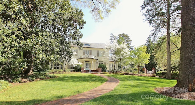 1137 Queens Rd W, Charlotte, NC 28207 - view of front of house with a front yard and a balcony