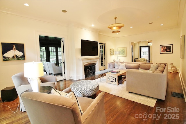 1137 Queens Rd W, Charlotte, NC 28207 - living room featuring ornamental molding, wood finished floors, a fireplace, recessed lighting, and baseboards