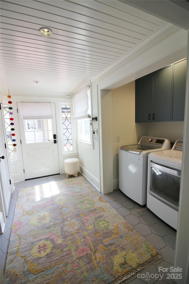 1137 Queens Rd W, Charlotte, NC 28207 - laundry area with independent washer and dryer, cabinet space, and light tile patterned floors
