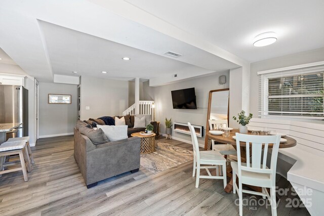 174 Ridge Rd, Lake Lure, NC 28746 - living room featuring light wood-style floors, stairway, and recessed lighting