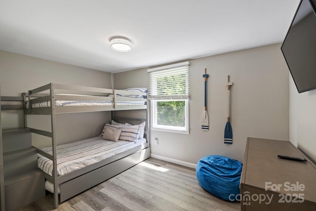 174 Ridge Rd, Lake Lure, NC 28746 - bedroom with wood finished floors and baseboards