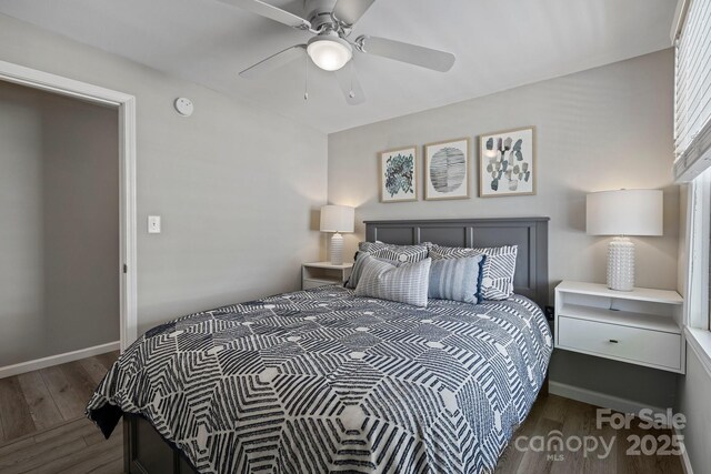 174 Ridge Rd, Lake Lure, NC 28746 - bedroom with wood finished floors and a ceiling fan