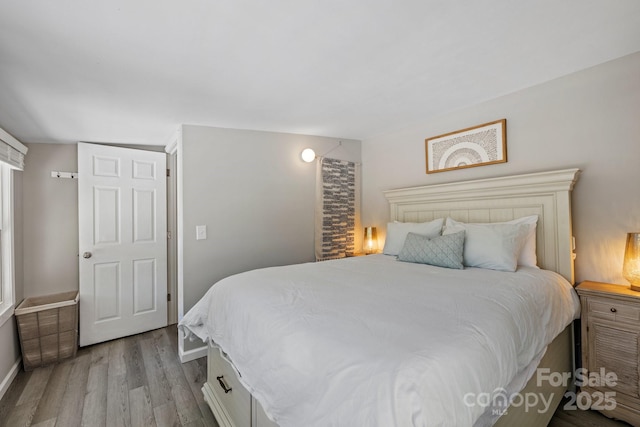 174 Ridge Rd, Lake Lure, NC 28746 - bedroom featuring wood finished floors and baseboards