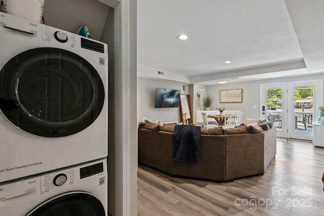 174 Ridge Rd, Lake Lure, NC 28746 - laundry area with stacked washing machine and dryer, light wood-type flooring, and recessed lighting