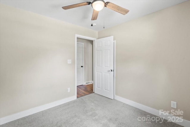 321 E Taylor St, Landis, NC 28088 - unfurnished room featuring carpet flooring, a ceiling fan, and baseboards
