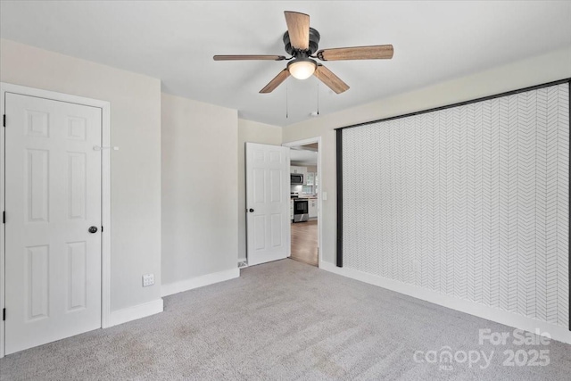 321 E Taylor St, Landis, NC 28088 - unfurnished bedroom featuring carpet floors, baseboards, and ceiling fan