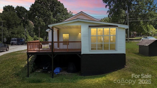 321 E Taylor St, Landis, NC 28088 - back of property featuring a yard and a wooden deck
