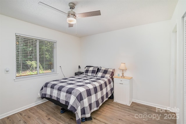 1602 Eagles Pl Unit J103, Rock Hill, SC 29732 - bedroom with light wood-style floors, a ceiling fan, and a textured ceiling