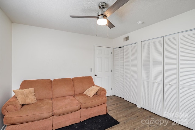 1602 Eagles Pl Unit J103, Rock Hill, SC 29732 - living room featuring wood finished floors, a ceiling fan, and a textured ceiling