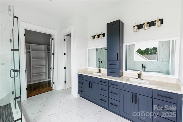115 Augusta Ln, Shelby, NC 28150 - bathroom featuring a marble finish shower, marble finish floors, double vanity, and a spacious closet