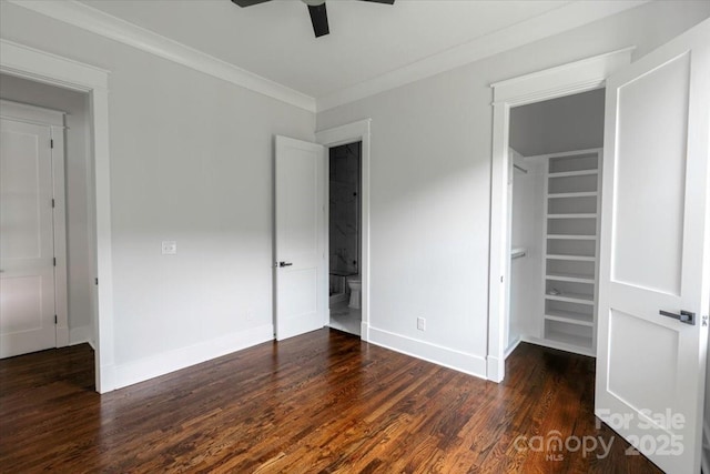 115 Augusta Ln, Shelby, NC 28150 - unfurnished bedroom with baseboards, a spacious closet, wood finished floors, a closet, and crown molding