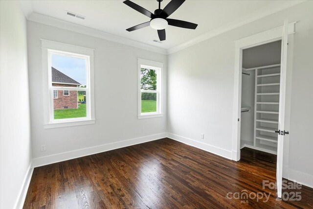 115 Augusta Ln, Shelby, NC 28150 - unfurnished bedroom with ornamental molding, dark wood finished floors, a spacious closet, baseboards, and a closet