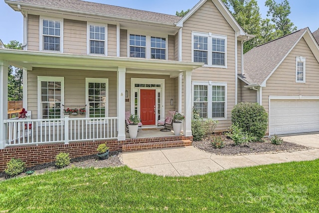 5832 Lagrande Dr, Charlotte, NC 28269 - traditional-style home with covered porch, a garage, and concrete driveway