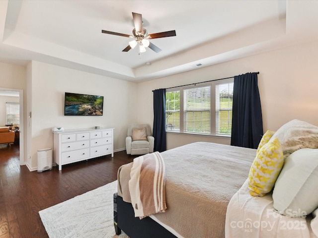 8035 Pastime Ln, Clover, SC 29710 - bedroom featuring a tray ceiling, wood finished floors, and a ceiling fan