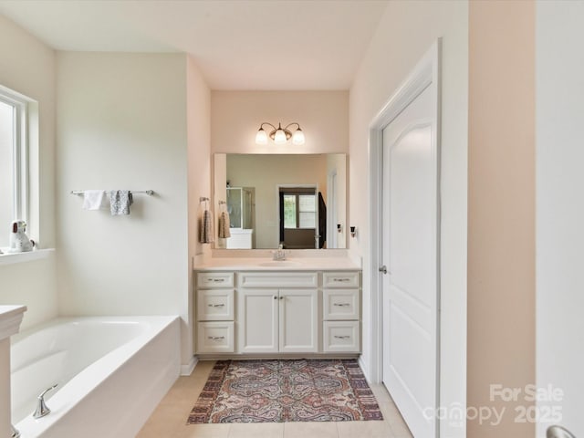 8035 Pastime Ln, Clover, SC 29710 - bathroom with vanity, a garden tub, a stall shower, and tile patterned flooring