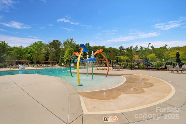 11313 Limehurst Pl, Charlotte, NC 28278 - community pool featuring a water play area and view of wooded area