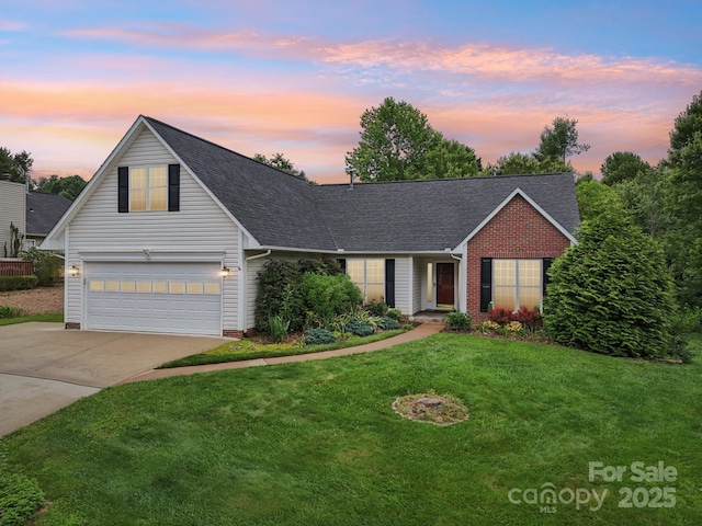 343 Stonehollow Rd, Fletcher, NC 28732 - traditional-style home with concrete driveway, a lawn, an attached garage, and roof with shingles