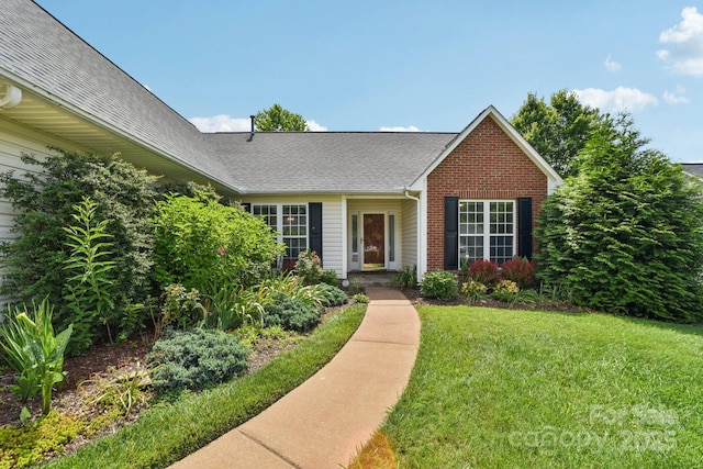 343 Stonehollow Rd, Fletcher, NC 28732 - view of front of property with a front yard and roof with shingles