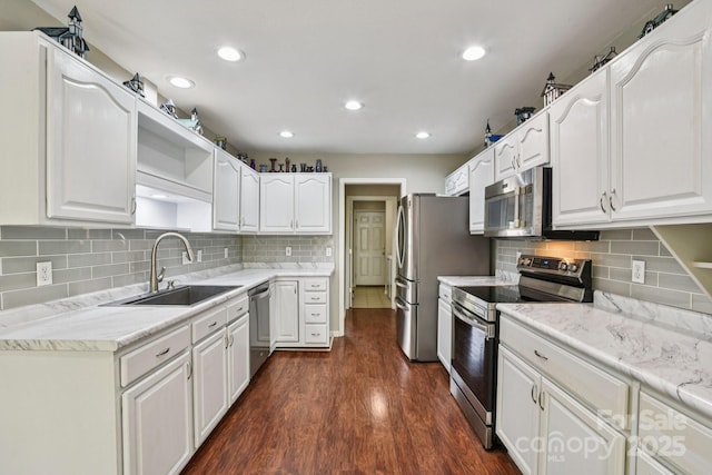 343 Stonehollow Rd, Fletcher, NC 28732 - kitchen with stainless steel appliances, open shelves, white cabinets, tasteful backsplash, and dark wood finished floors