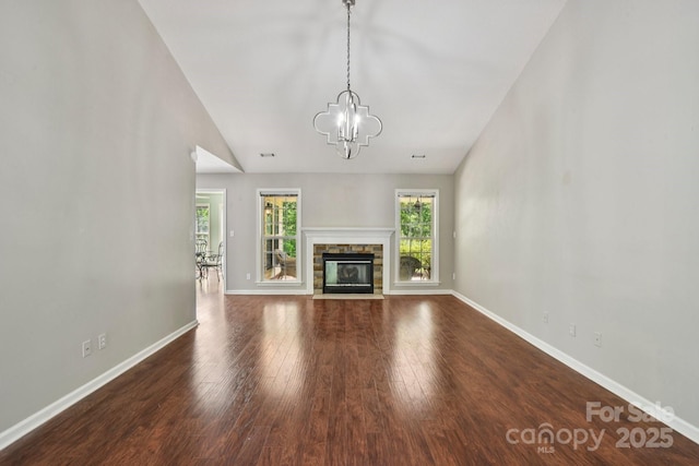 343 Stonehollow Rd, Fletcher, NC 28732 - unfurnished living room featuring a chandelier, wood finished floors, and a fireplace