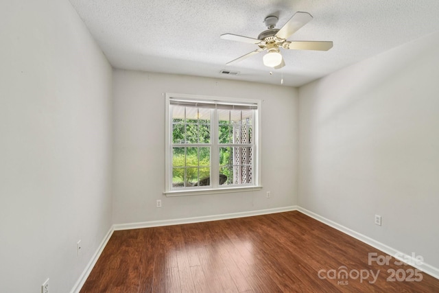 343 Stonehollow Rd, Fletcher, NC 28732 - empty room featuring wood finished floors, a textured ceiling, and ceiling fan