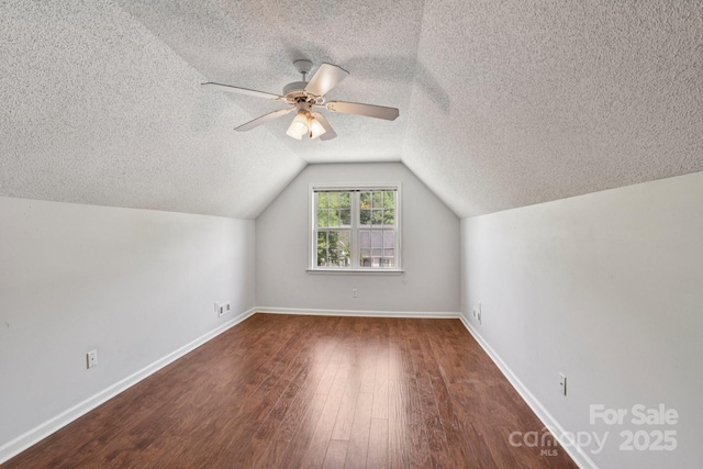 343 Stonehollow Rd, Fletcher, NC 28732 - bonus room featuring wood finished floors, a textured ceiling, lofted ceiling, and ceiling fan